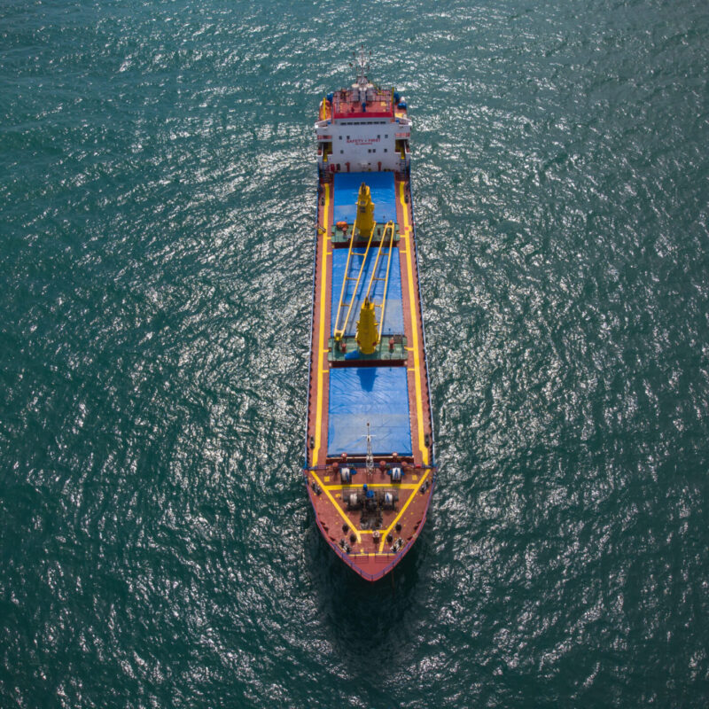 Large general cargo ship tanker bulk carrier, aerial top view.