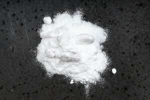 pile of sodium bicarbonate close up on black